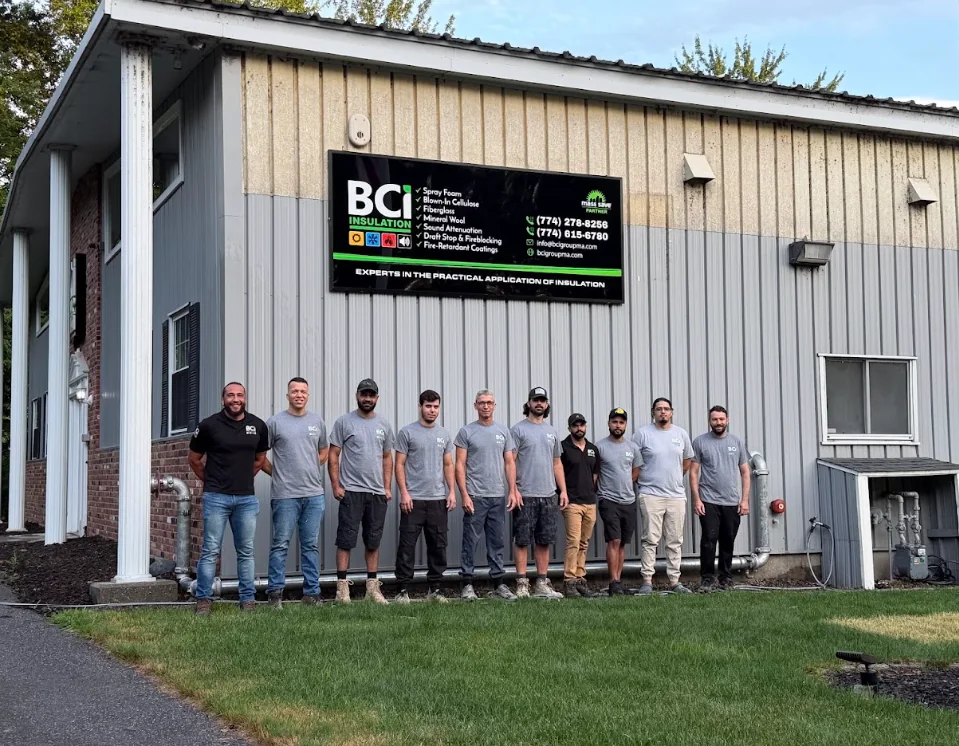 BCI Insulation team standing together outside the company building