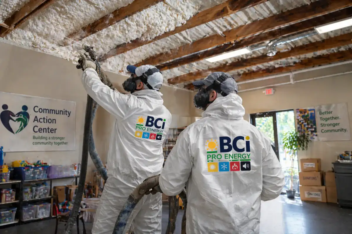 BCI team applying spray foam in a church interior